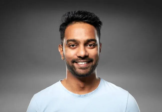 A man with restored hair density after a personalised treatment plan.